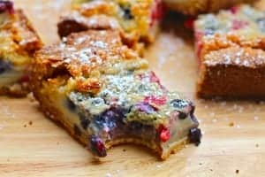 Summer Custard Bars With Fresh Berries Garnished With Powdered Sugar