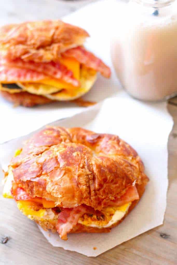 overhead view of croissant breakfast sandwiches on napkins