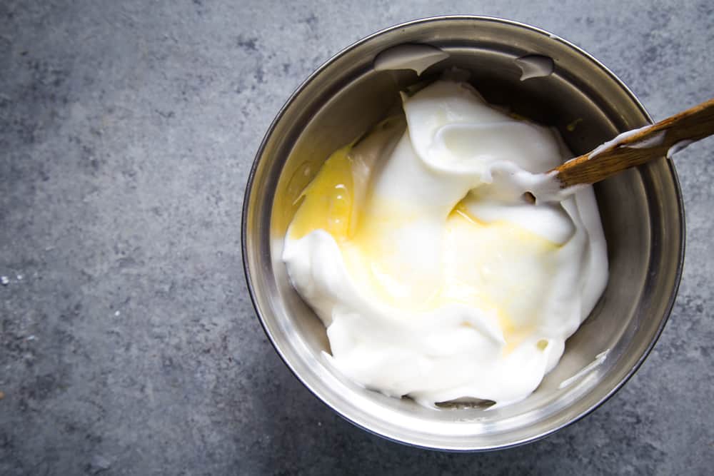 combining egg yolk and whites to make ladyfingers