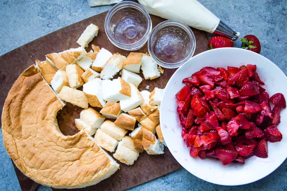 assembly of strawberry angel food cake in a jar