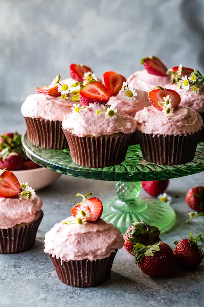 multiple sprinkle's strawberry cupcakes on cake plate