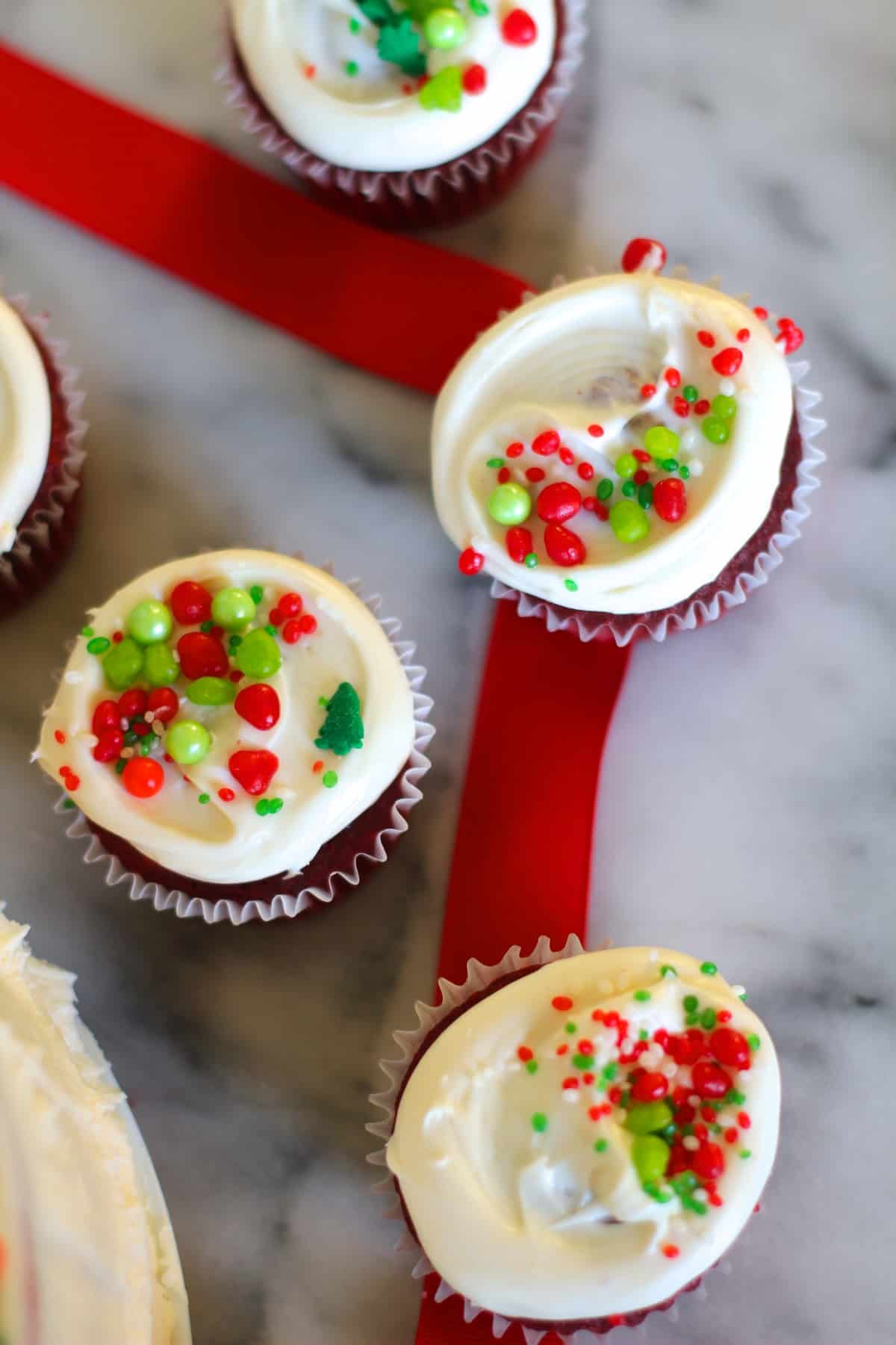 red velvet cupcakes on a marble surface. 