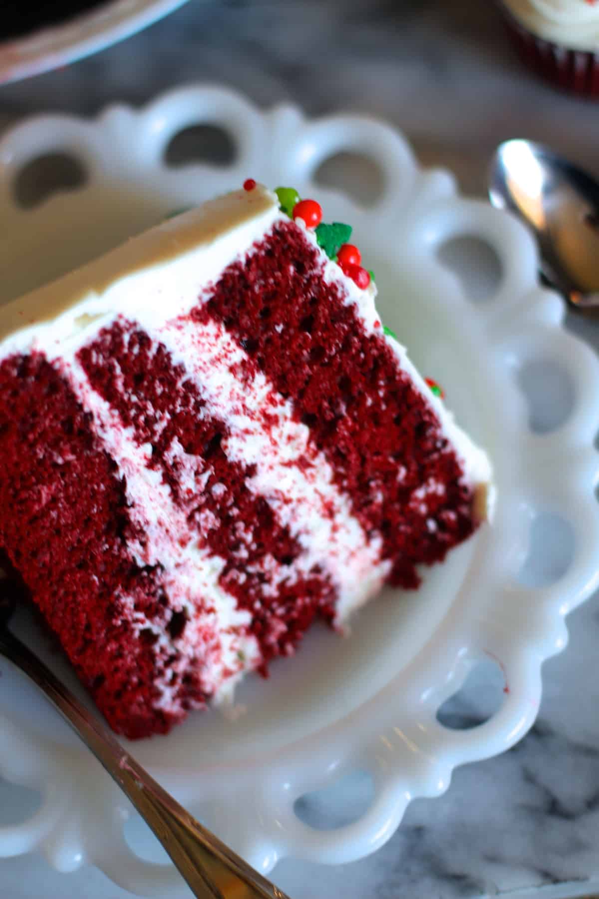 slice of the three layer cake on a white plate. 