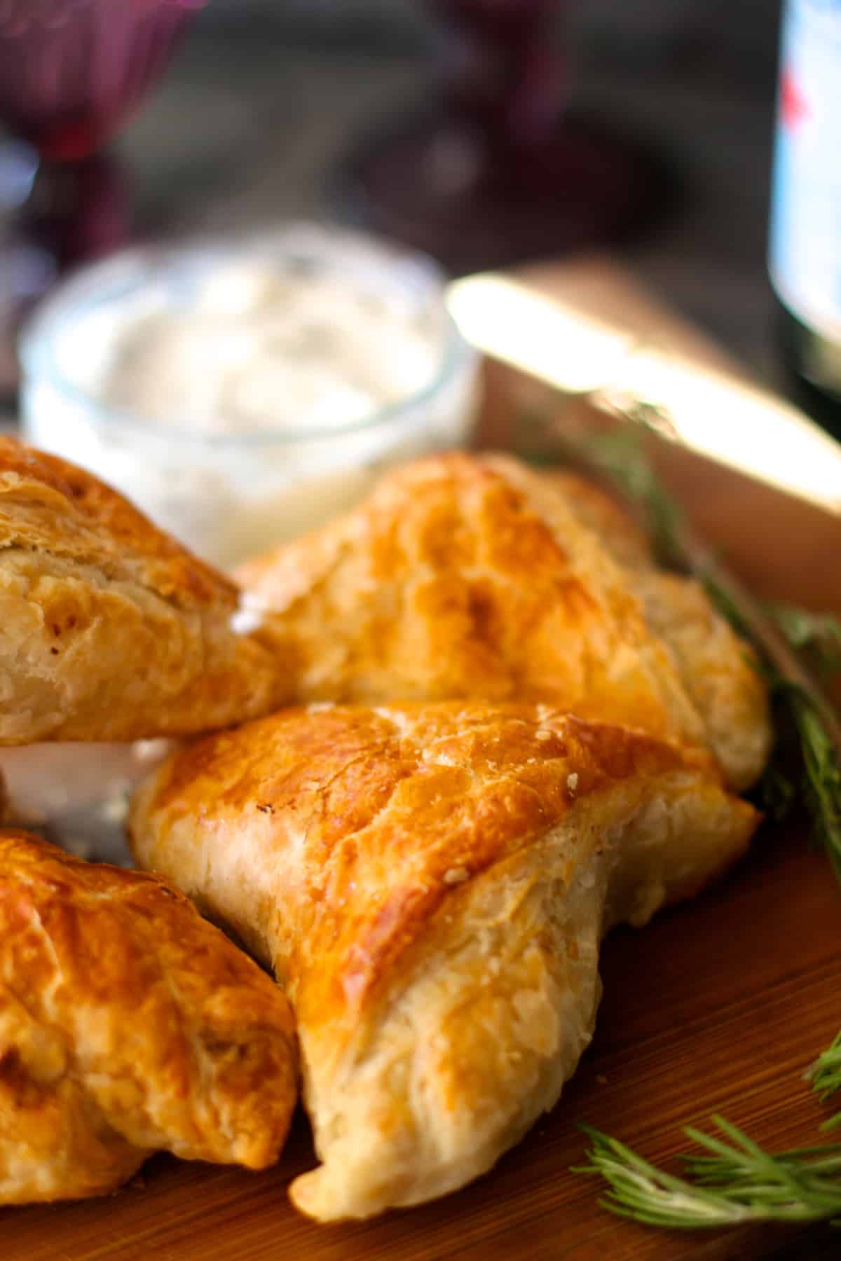 Lamb and mushroom puff pastry triangles with rosemary garlic dipping sauce