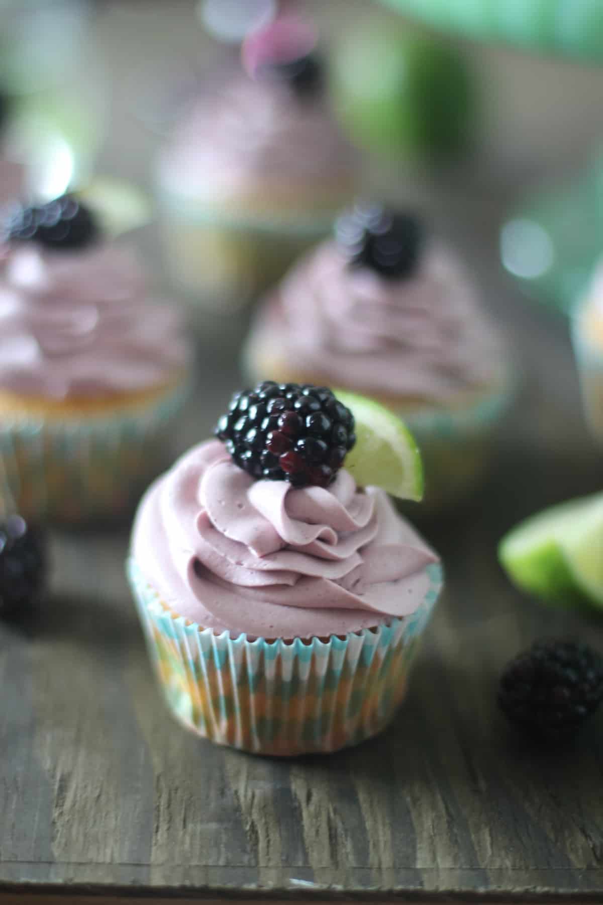 Soft lime cupcakes topped with a sweet blackberry cream cheese frosting