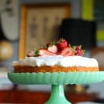 easy tres leches cake on a green cake stand