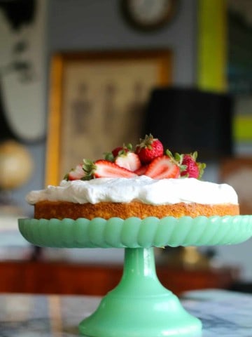 easy tres leches cake on a green cake stand