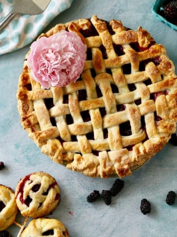 Fresh vine ripe boysenberries in a flaky all butter lattice crust. This boysenberry pie is easy to make and delicious!