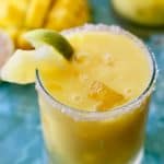 Easy to make margarita made with fresh mango, pineapple juice and passion fruit syrup. The perfect drink on a hot summer day!