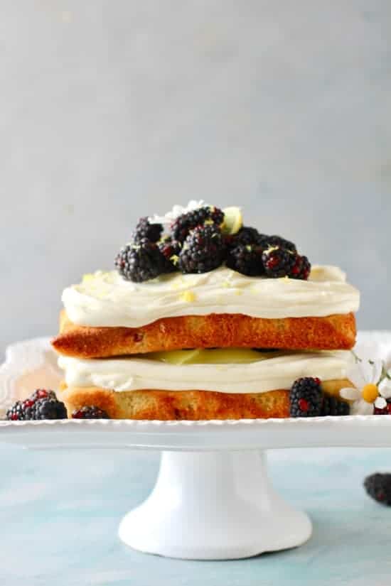 Vanilla lemon infused cake studded with fresh juicy blackberries and layered with fresh lemon curd and cream cheese frosting! 