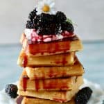Fresh homemade copycat Ihop blackberry syrup with crispy Belgium Waffles