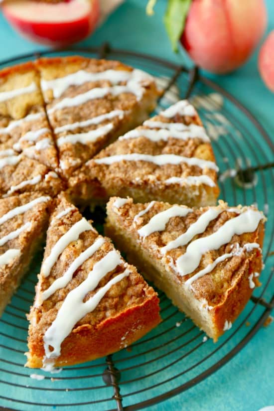 This White Peach Coffee Cake starts with a sweet butter cake studded with fresh peach chunks and topped with a delicious brown sugar crumb topping.