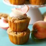 Cinnamon bourbon cupcakes with fresh peaches and a brown sugar streusel topping. Topped with a sweet bourbon peach cinnamon frosting.