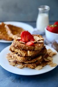 A crushed Cinnamon Toast Crunch coated french bread that is crispy on the outside and soft in the center. Makes for the perfect fun breakfast or brunch.