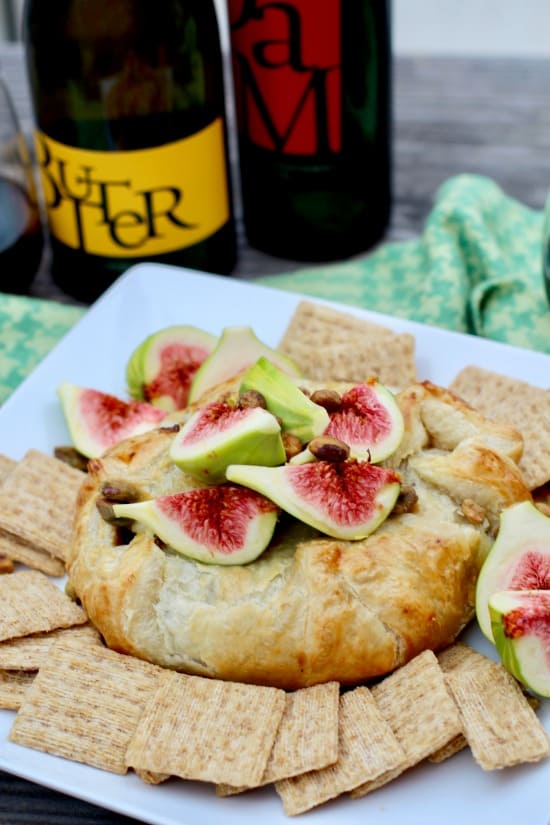 Fresh tiger fig topped baked brie in crispy puff pastry