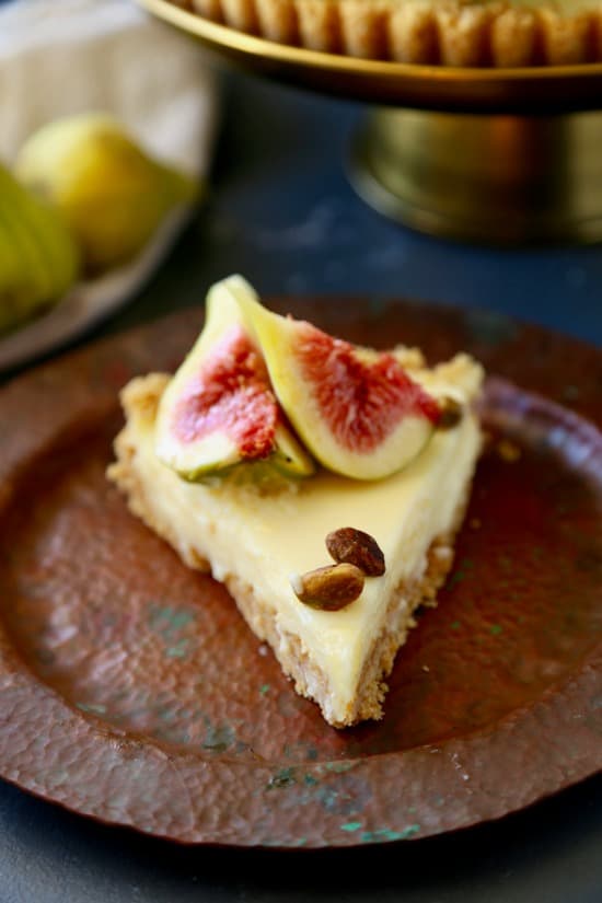 Stunning no bake mascarpone tart topped with fresh tiger figs, honey, and pistachios