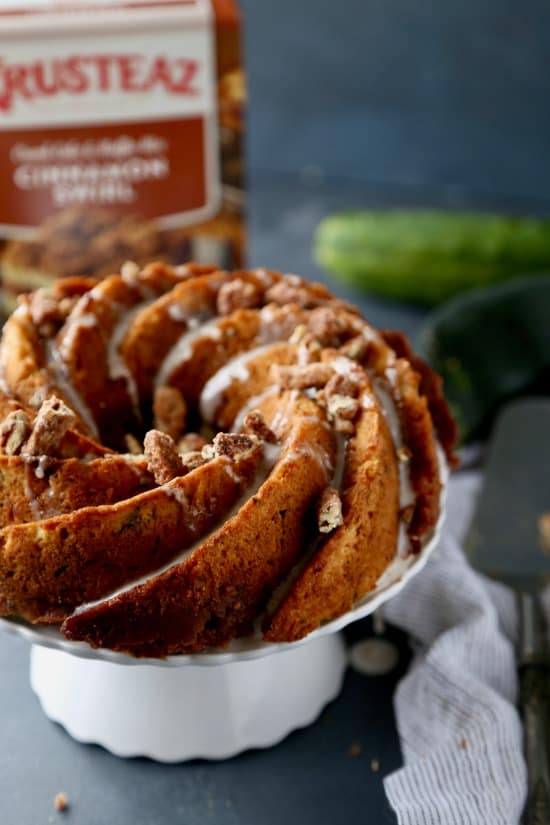 Perfect crumb cake that is full of shredded zucchini and layered with a brown sugar topping. #krusteaz #cakemixrecipes #zucchini #gardenrecipes #cake #breakfast #candiedpecans