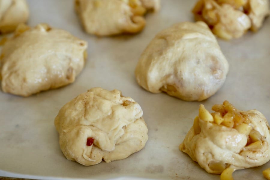 apple fritter donut dough rolled into balls before putting in the fryer. 