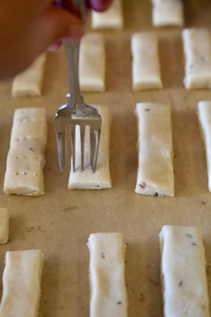 fork piercing raw lavender shortbread cookie bars