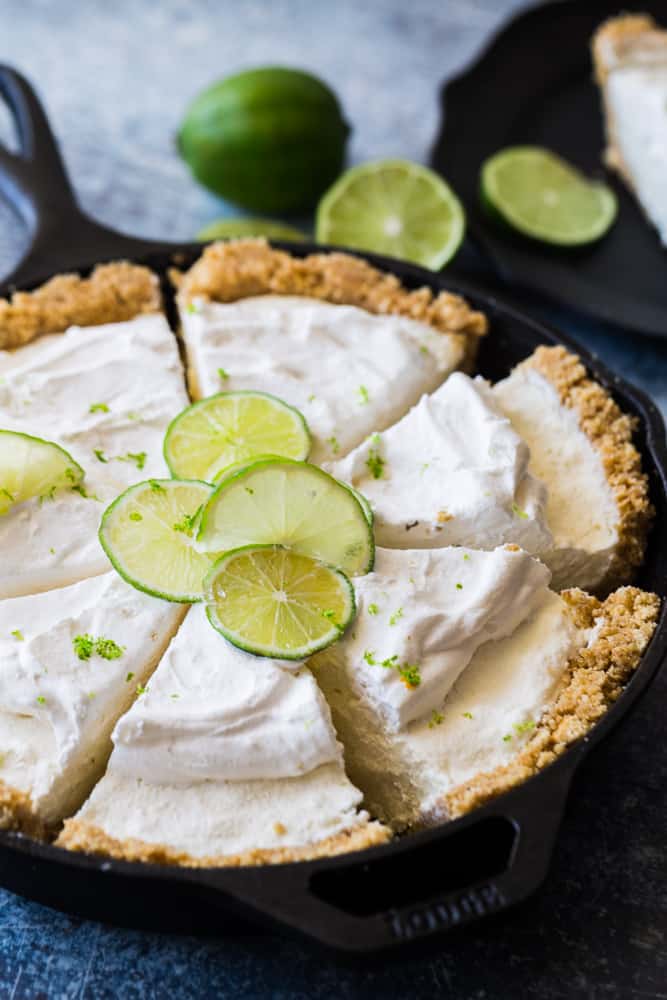 no bake key lime pie sliced with limes on top