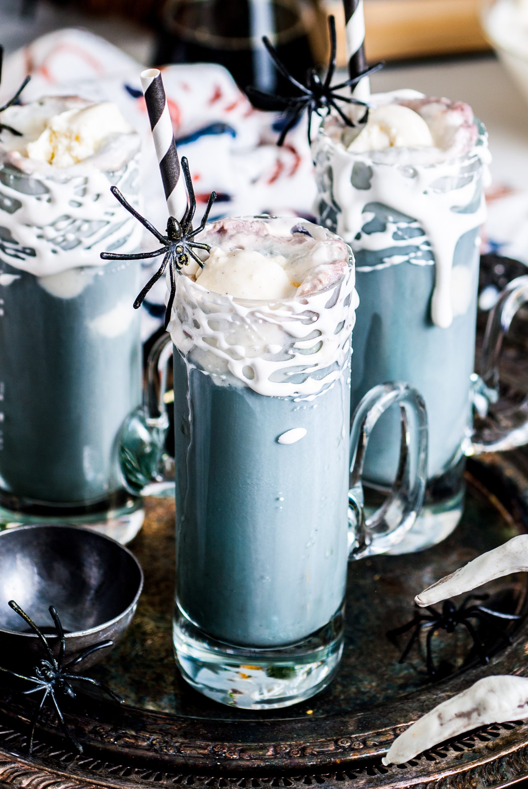 Up close shot of the black root beer floats with scoops of ice cream. 