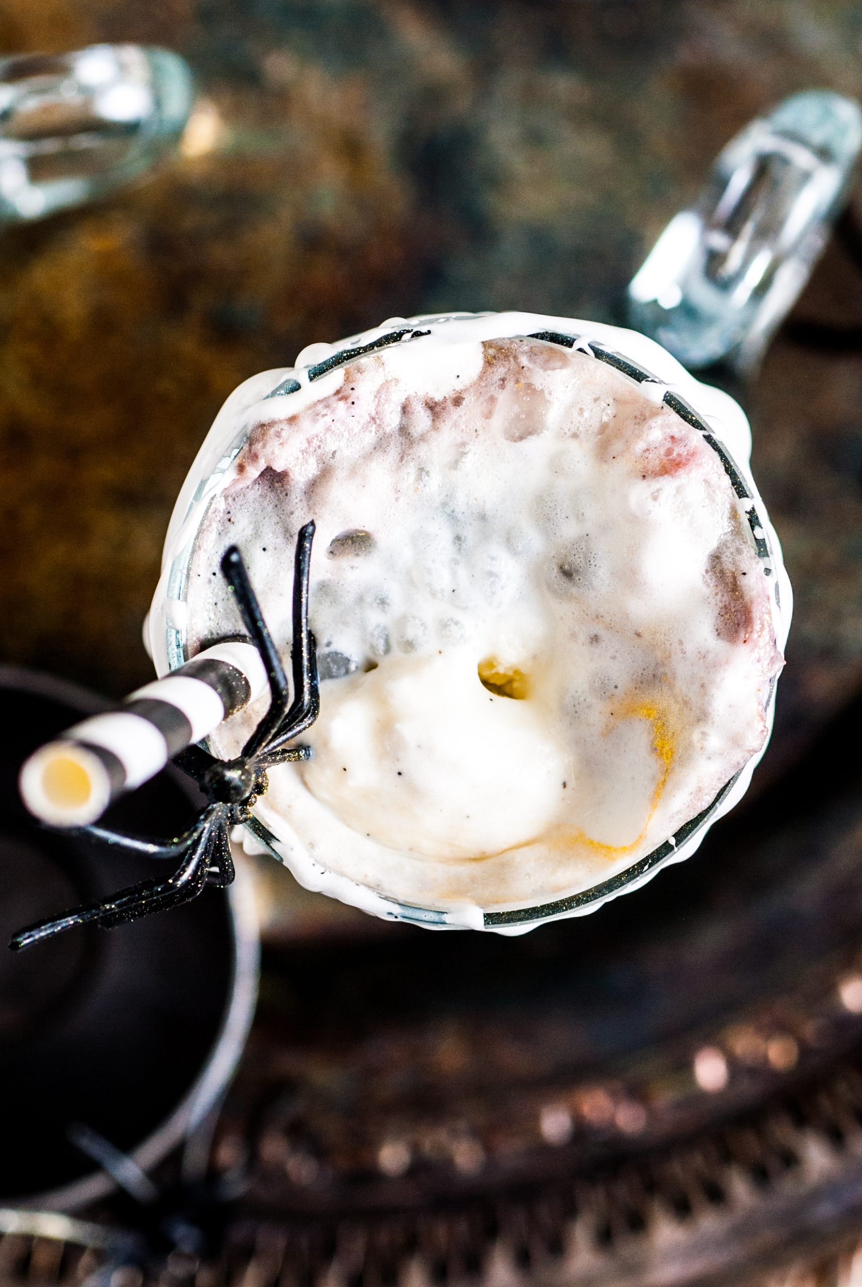 Overhead shot of the ice cream melting into the black root beer. 