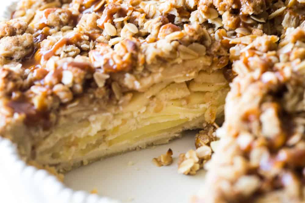 Inside the apple buttermilk pie showing the crust, custard, and apple layers. 