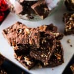 pecan fudge squares stacked on marble- square feature image.