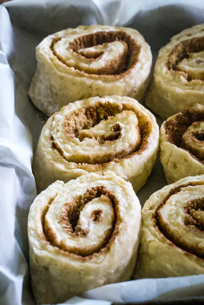 biscuit cinnamon rolls in pan before baking