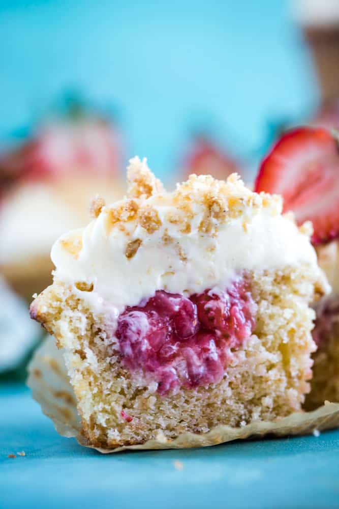 Graham cracker cupcakes filled with a strawberry puree and topped with a cheesecake filling frosting.