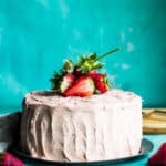 strawberry rhubarb layer cake with strawberries on top