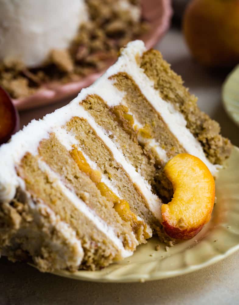 plated slice of peach layer cake