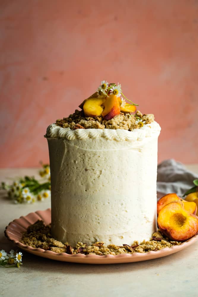 Tall peach layer cake with crumble topping