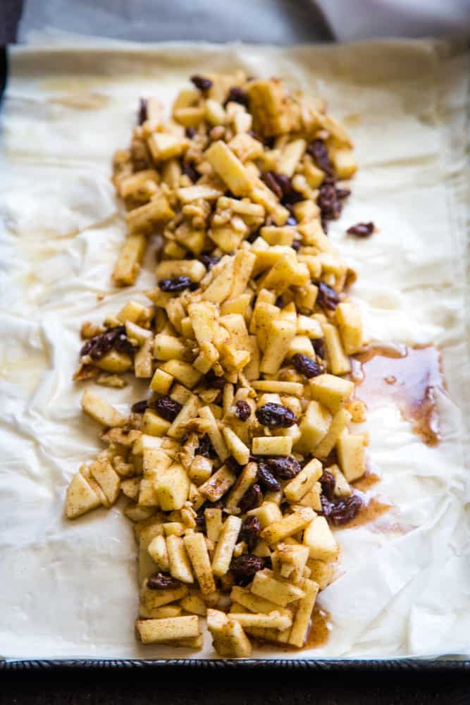 making the apple strudel with phyllo dough with filling