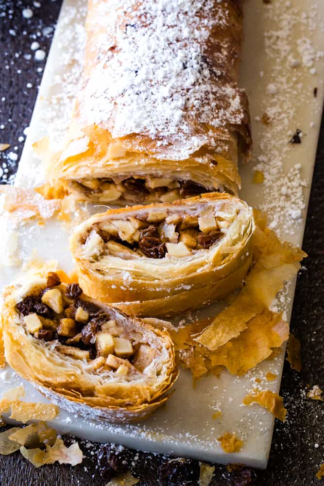 log and slices of apple strudel with phyllo dough
