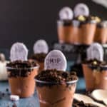 graveyard pudding cups with oreo crumble and white chocolate covered tombstones