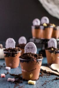 graveyard pudding cups with oreo crumble and white chocolate covered tombstones