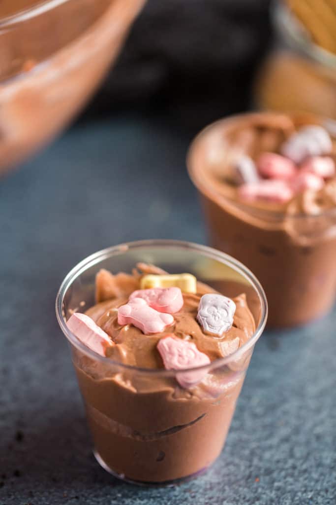 Pudding cups with candy skull and bones before adding the "dirt"