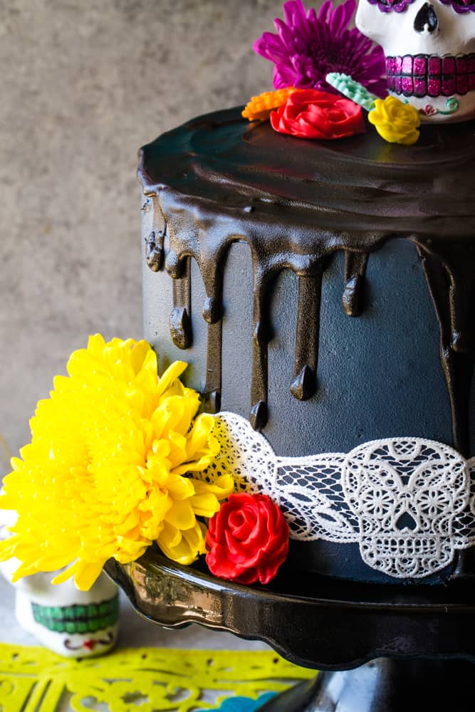 fresh flowers around day of the dead cake