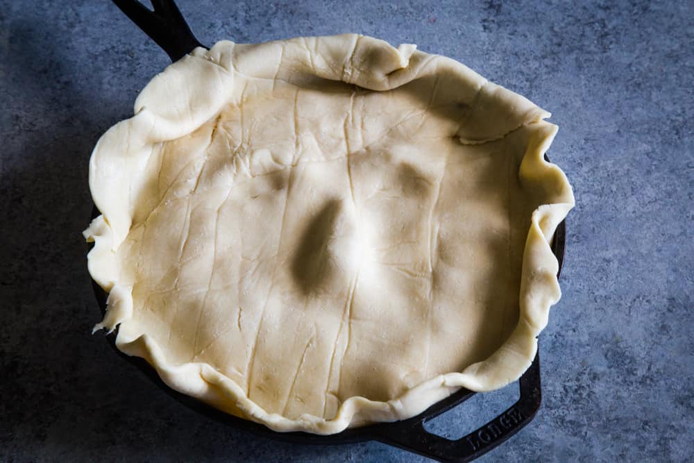 add top pie crust to halloween face pie dip