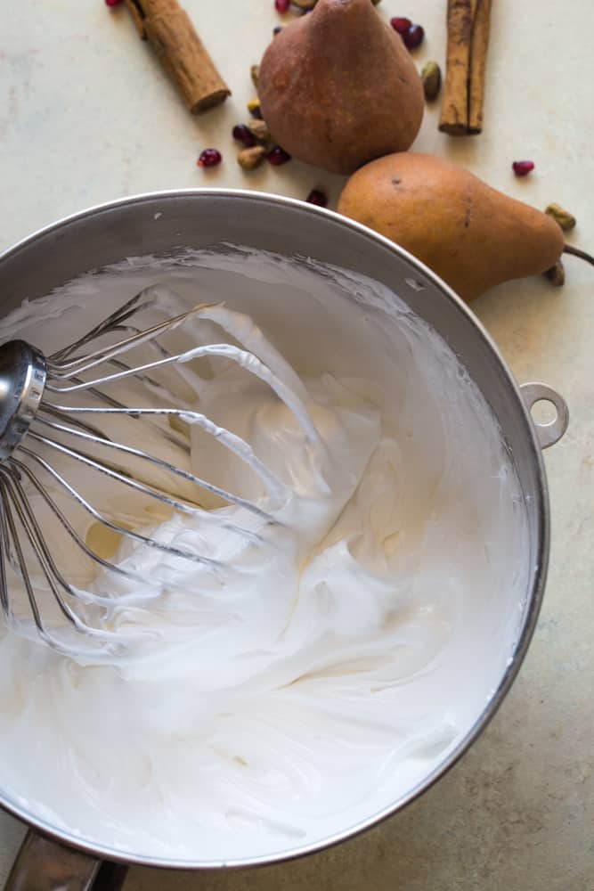 Beating the egg whites for pavlova with pomegranate pears