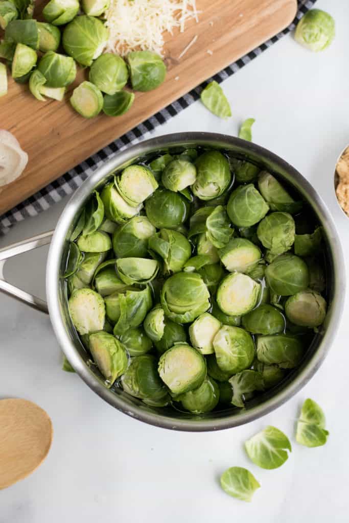 brussels sprouts au gratin in pan ready for a boil