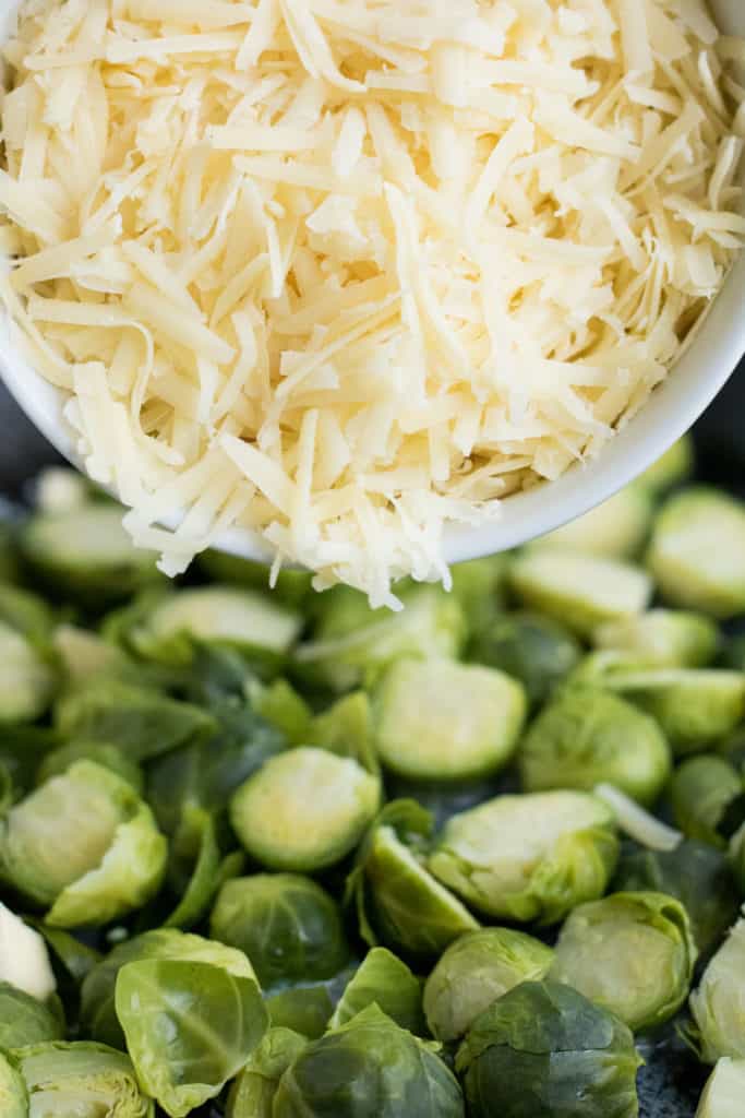 layering the cheese for the brussels sprouts au gratin 