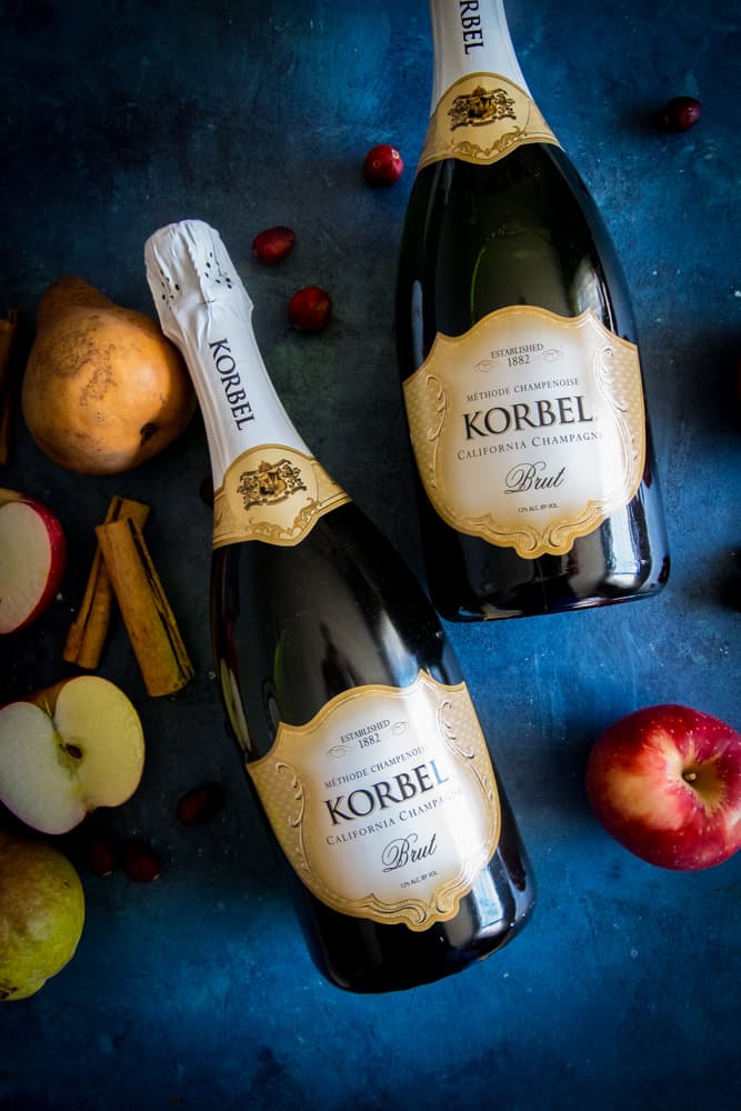 bottles of korbel and apples