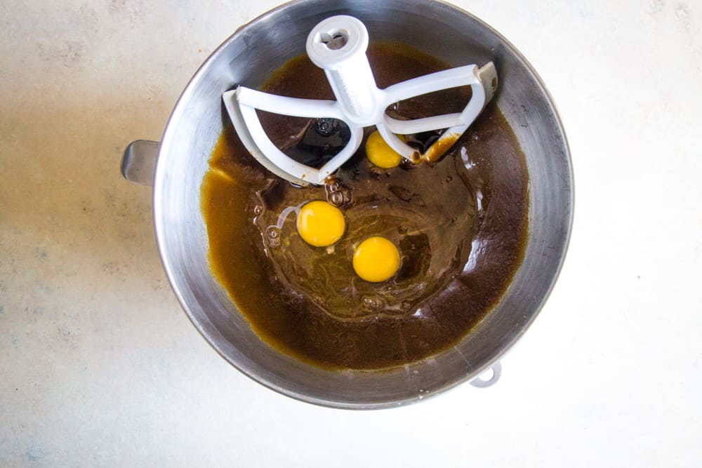 Adding the eggs to the oil/sugar mixture and using paddle attachment to mix. 