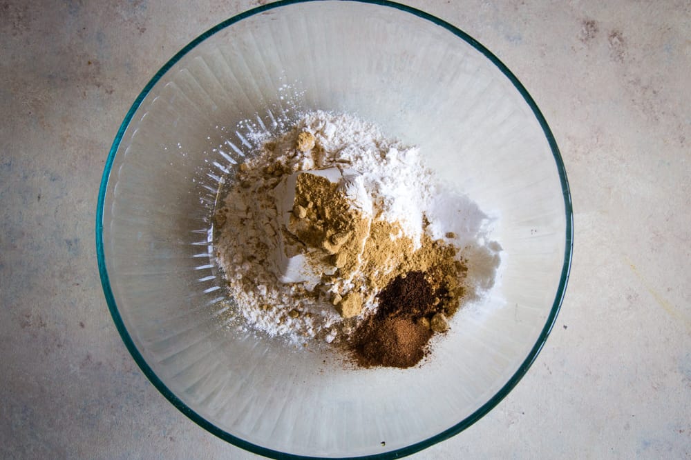Glass bowl of flour and spice ingredients for cake batter.  