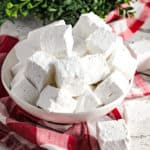 homemade vanilla marshmallows in white bowl with red dish towel