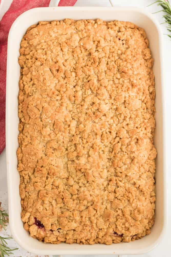 Overhead shot of the baked coffee cake in large white baking dish. 