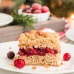 slice of cranberry sauce coffee cake on white plate