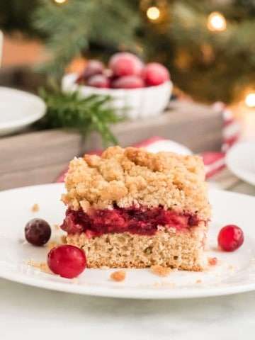 slice of cranberry sauce coffee cake on white plate